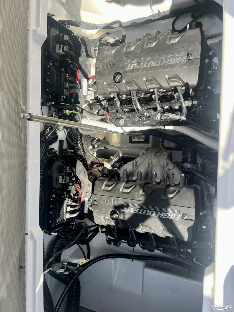Slide: The Image of 2021 Yamaha AR250 boat engine compartment with dual high-output engines. - 9