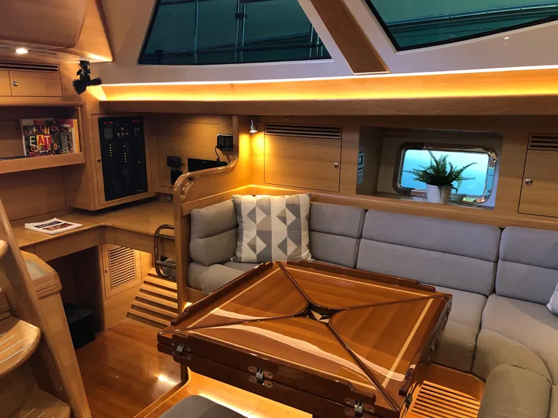 Slide: The Image of Luxurious interior of 2020 Outbound 56 yacht with elegant wood finishes and modern seating. - 18