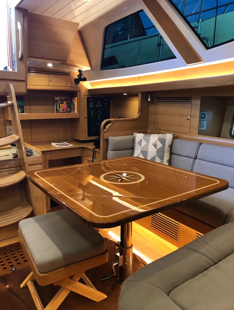 Slide: The Image of Luxurious interior of 2020 Outbound 56 yacht with elegant wood finishes and modern seating. - 19
