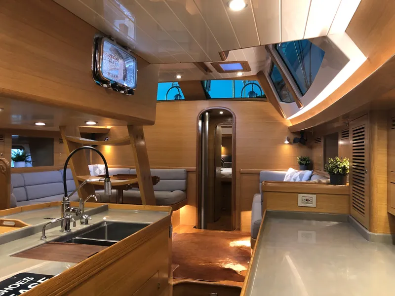 Slide: The Image of Luxurious interior of 2020 Outbound 56 yacht with modern kitchen and seating area. - 23