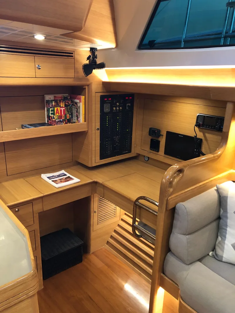 Slide: The Image of Modern interior of 2020 Outbound 56 yacht with wooden cabinetry and navigation equipment. - 24