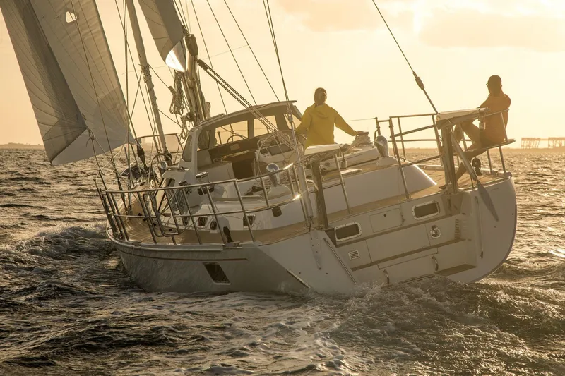 Slide: The Image of Sailing yacht Outbound 56 (2020) navigating ocean waves at sunset. - 42