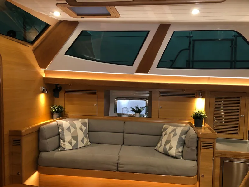 Slide: The Image of Luxurious interior of 2020 Outbound 56 yacht with modern seating and ambient lighting. - 48