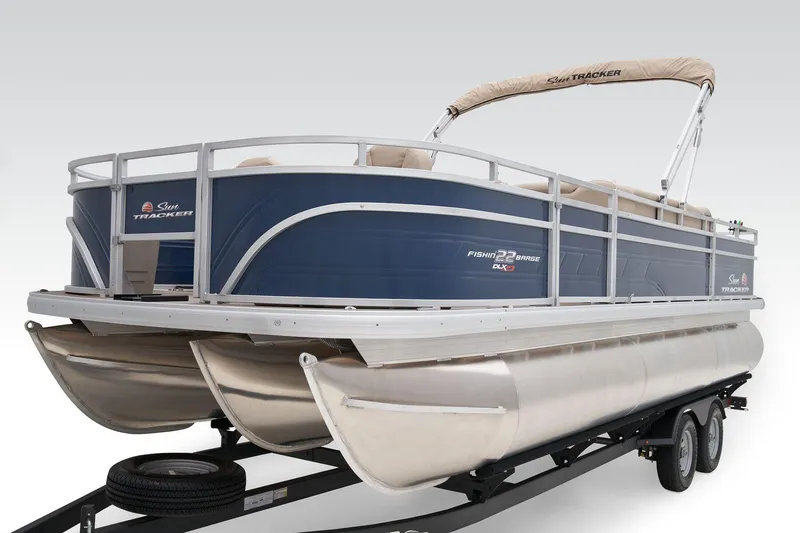 Slide: The Image of 2024 Sun Tracker Fishin' Barge 22 XP3 pontoon boat on trailer. - 18