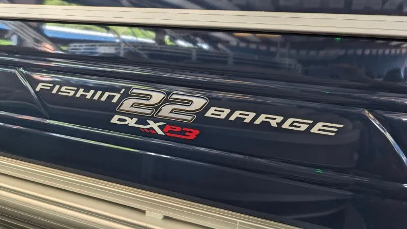 Slide: The Image of 2024 Sun Tracker Fishin' Barge 22 XP3 logo on boat exterior. - 3