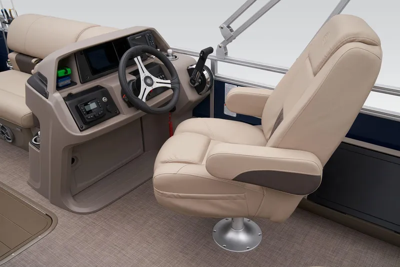 Slide: The Image of 2024 Sun Tracker Fishin' Barge 22 XP3 helm with beige captain's chair and control console. - 37