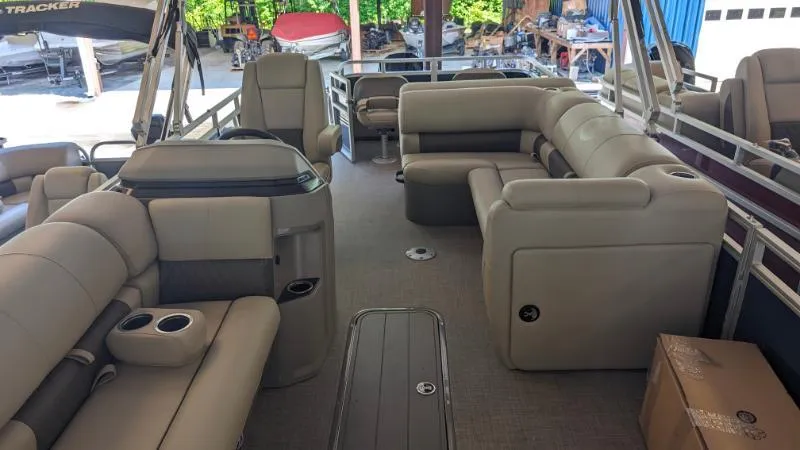 Slide: The Image of 2024 Sun Tracker Fishin' Barge 22 XP3 interior with spacious seating and modern amenities. - 4