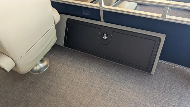 Slide: The Image of 2024 Sun Tracker Fishin' Barge 22 XP3 interior storage compartment and seating. - 46