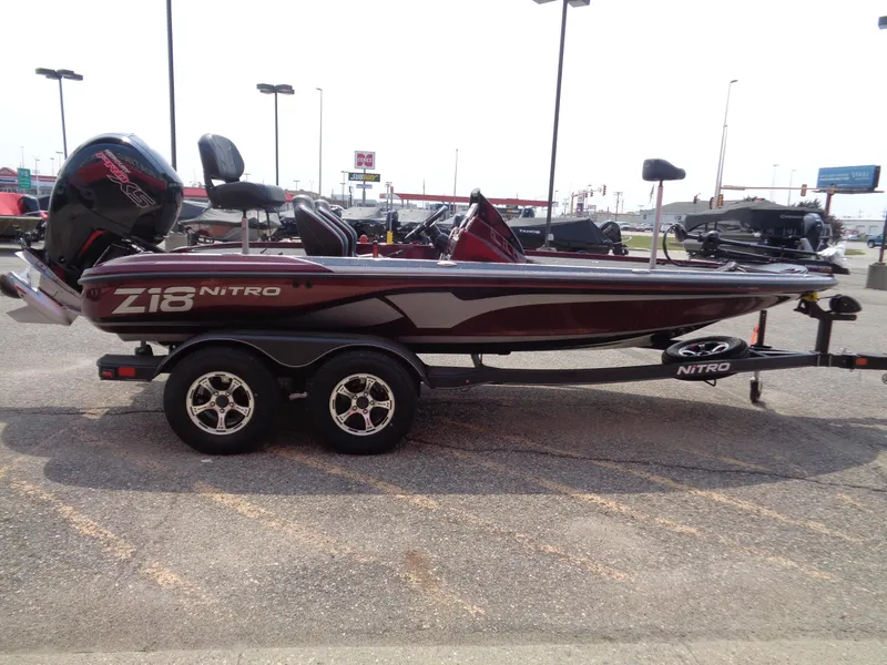 Slide: The Image of 2024 Nitro Z18 fishing boat on trailer in parking lot. - 3