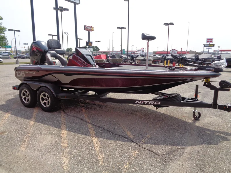 Slide: The Image of 2024 Nitro Z18 boat on trailer in parking lot. - 4