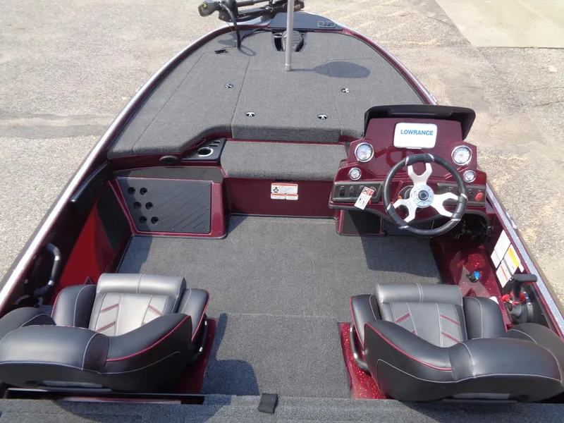 Slide: The Image of 2024 Nitro Z18 boat interior with steering wheel and seating. - 6