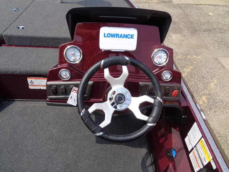 Slide: The Image of 2024 Nitro Z18 boat dashboard with Lowrance electronics and steering wheel. - 7