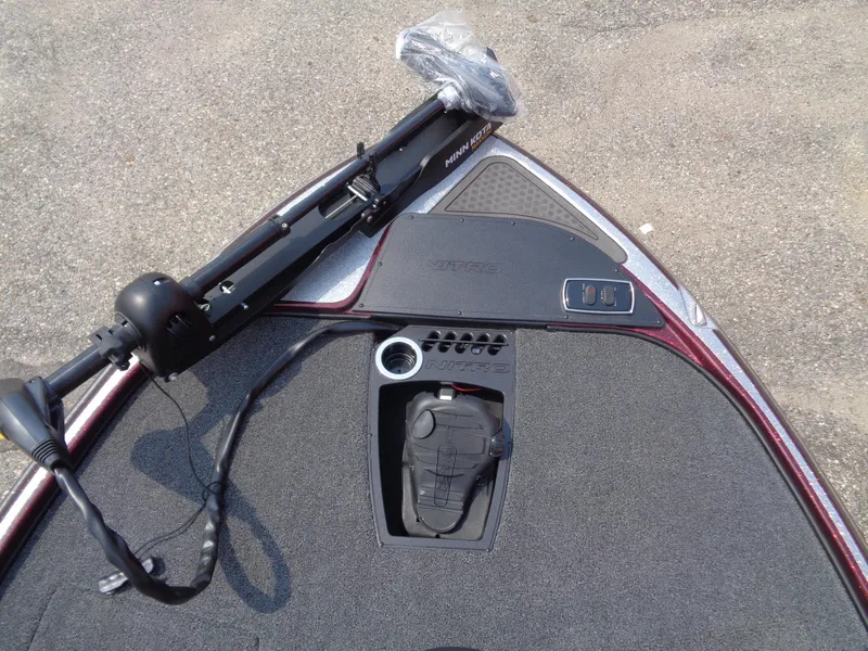 Slide: The Image of 2024 Nitro Z18 boat deck with trolling motor and foot pedal. - 8