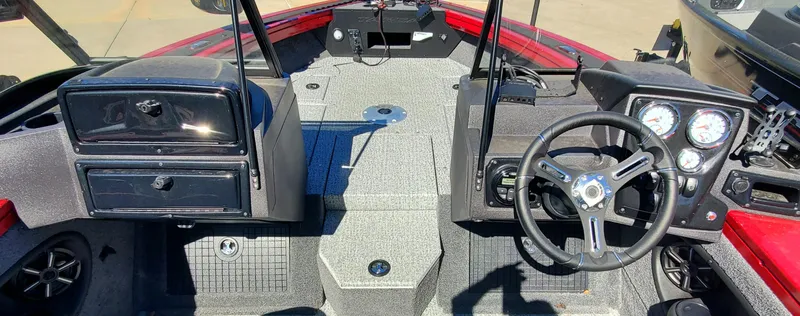 Slide: The Image of 2024 Tracker Targa V-19 WT boat interior with steering wheel and dashboard. - 3