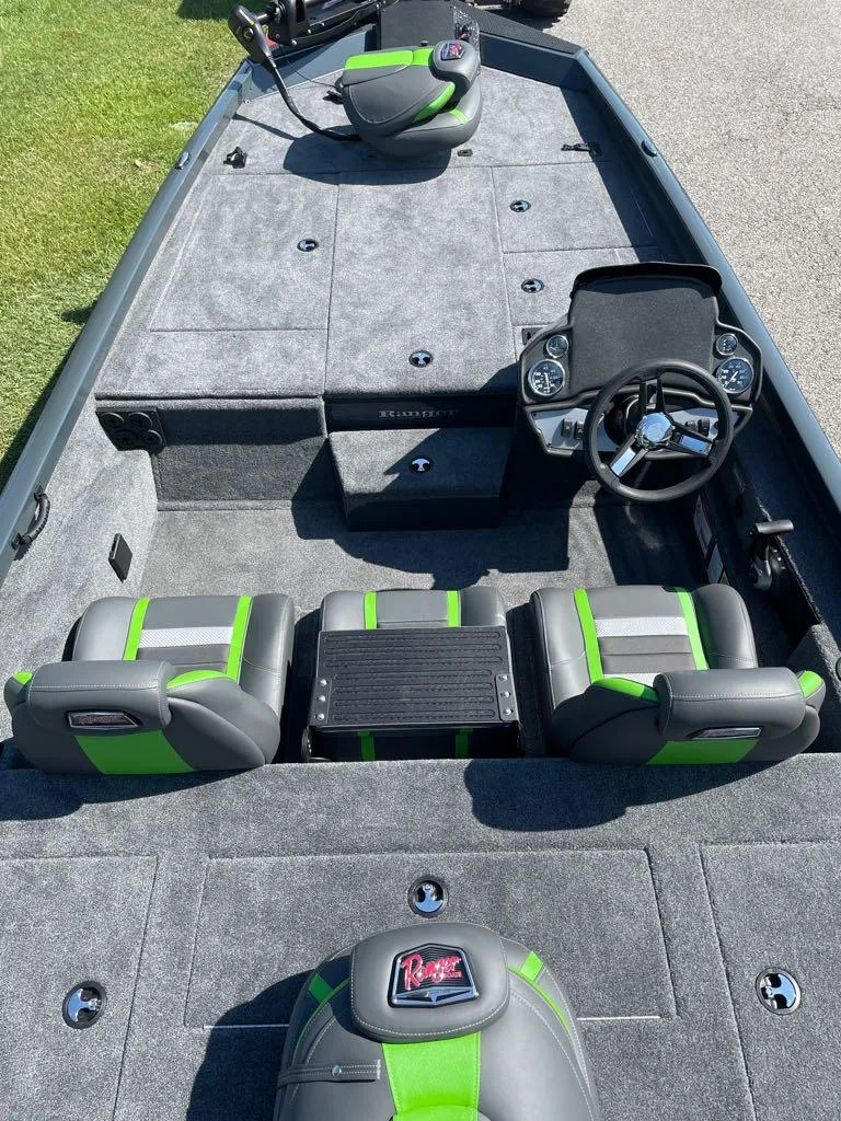 Slide: The Image of 2024 Ranger RT188P fishing boat interior with gray and green seats. - 4