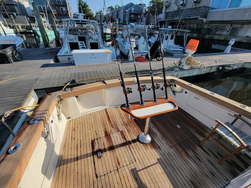 Slide: The Image of 1991 Ocean Yachts 42 Super Sport fishing deck at marina. - 24