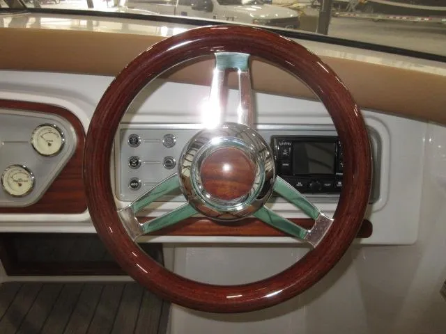 Slide: The Image of 2023 Thoroughbred u23i boat steering wheel and dashboard controls - 14
