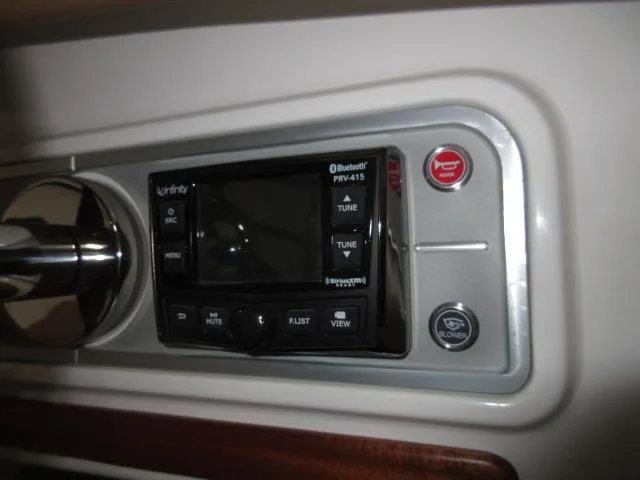 Slide: The Image of Thoroughbred u23i 2023 dashboard with Infinity Bluetooth stereo and control buttons. - 15