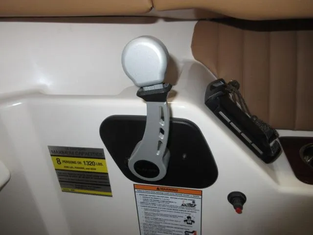 Slide: The Image of Throttle control lever on a 2023 Thoroughbred u23i boat. - 18