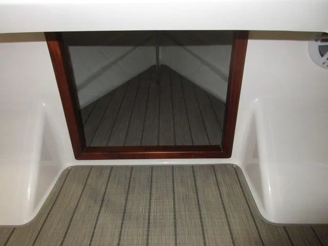 Slide: The Image of Interior of 2023 Thoroughbred u23i boat with wooden trim and striped flooring. - 19