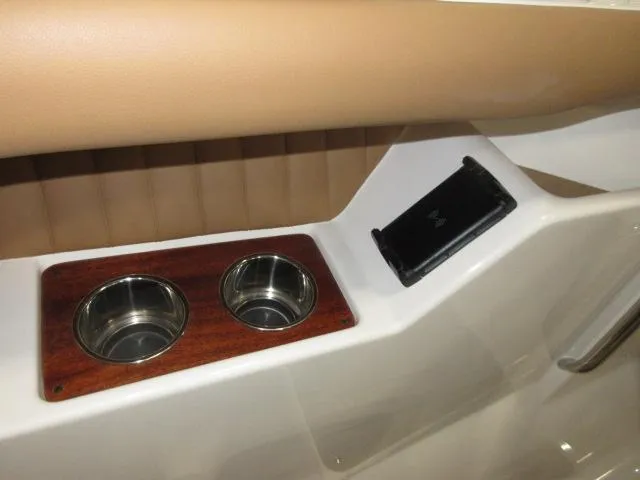 Slide: The Image of Interior of 2023 Thoroughbred u23i boat with cup holders and storage compartment. - 21