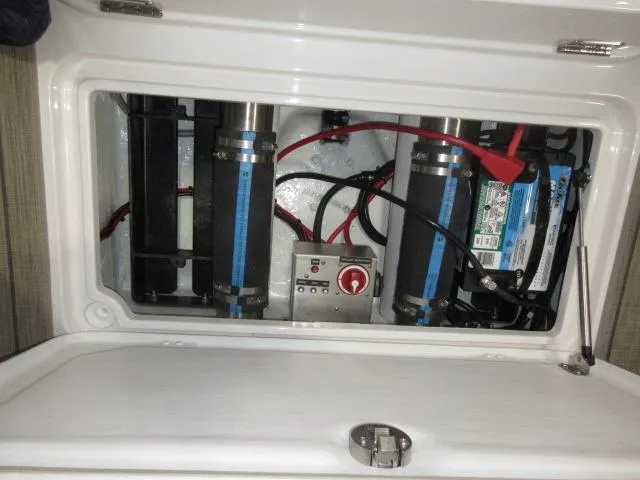Slide: The Image of Thoroughbred u23i 2023 model electrical compartment with batteries and wiring. - 26