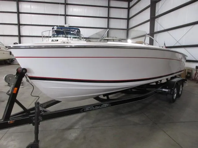 Slide: The Image of 2023 Thoroughbred u23i boat on trailer in indoor storage facility. - 3