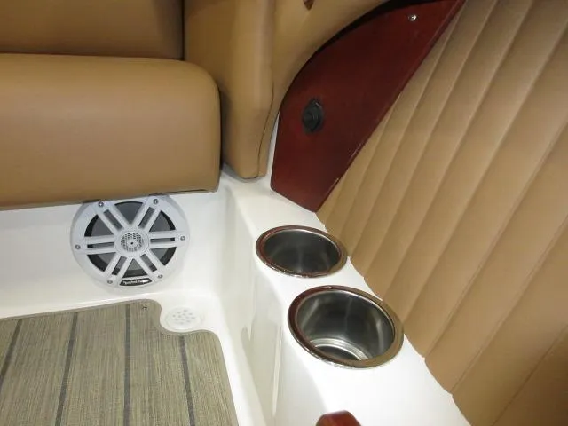 Slide: The Image of Thoroughbred u23i 2023 boat interior with cup holders and speaker. - 33