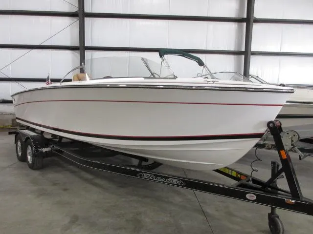 Slide: The Image of 2023 Thoroughbred u23i boat on a trailer in a storage facility. - 4