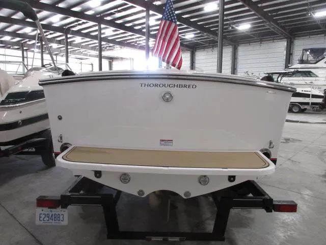 Slide: The Image of 2023 Thoroughbred u23i boat on trailer in indoor storage facility. - 7
