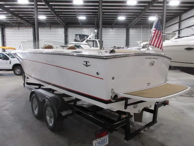 Slide: The Image of 2023 Thoroughbred u23i boat on trailer in indoor storage facility. - 8