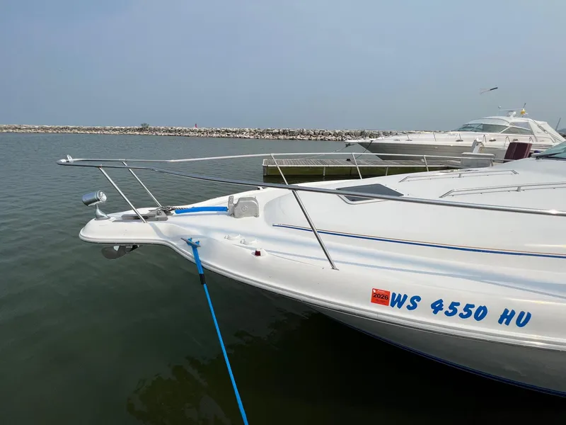 Slide: The Image of 1996 Sea Ray 330 Sundancer docked in a marina. - 13
