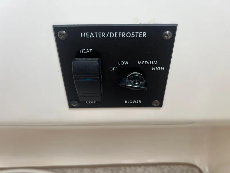 Slide: The Image of Heater/defroster control panel on a 1996 Sea Ray 330 Sundancer boat. - 37