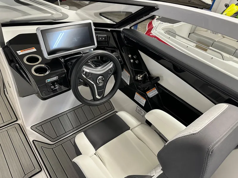 Slide: The Image of Interior of 2023 Yamaha Boats 275SD with modern helm. - 3