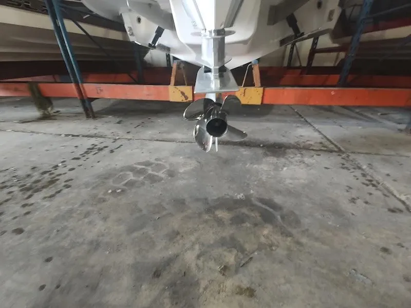 Slide: The Image of 2022 Cobalt 23SC boat propeller in storage facility. - 13