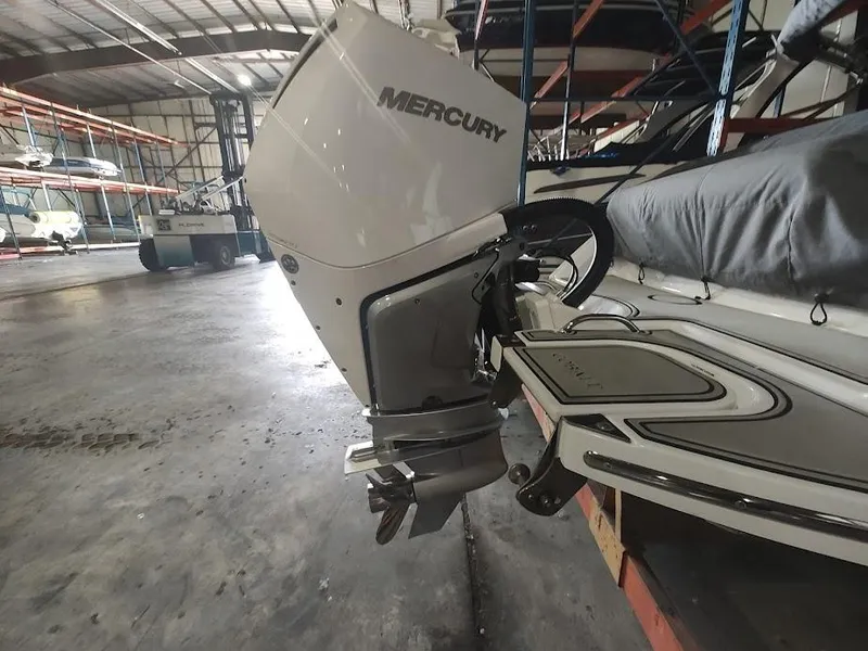 Slide: The Image of 2022 Cobalt 23SC boat with Mercury outboard motor in storage facility. - 15