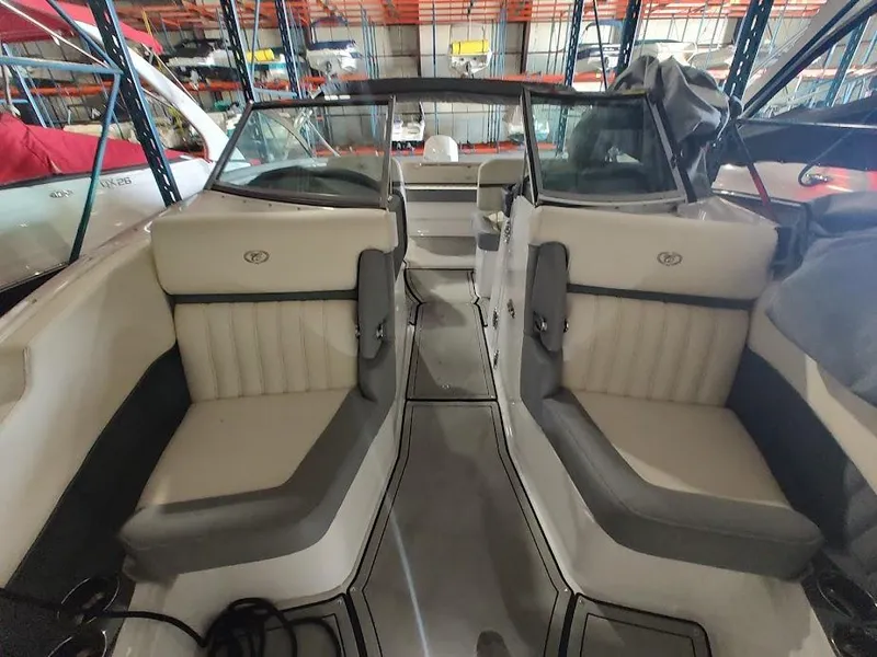Slide: The Image of 2022 Cobalt 23SC boat interior with dual seating in storage facility. - 19