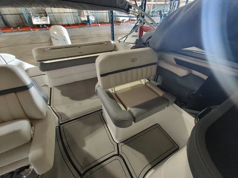 Slide: The Image of Interior of 2022 Cobalt 23SC boat with seating and storage compartments. - 25