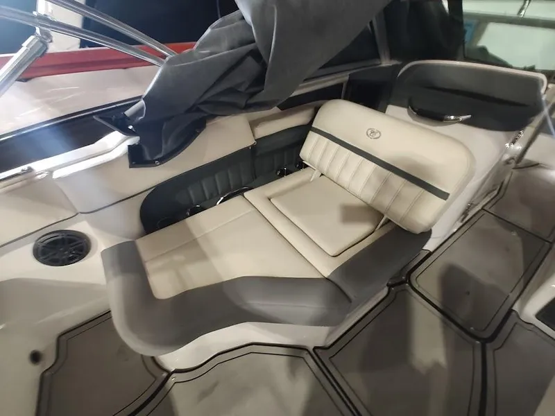 Slide: The Image of 2022 Cobalt 23SC boat interior with cushioned seating and modern design. - 33