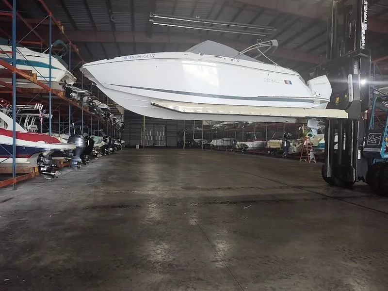 Slide: The Image of 2022 Cobalt 23SC boat in a storage facility. - 4