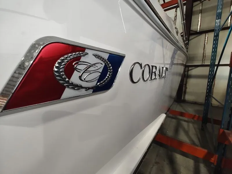 Slide: The Image of 2022 Cobalt 23SC boat side view in storage. - 42