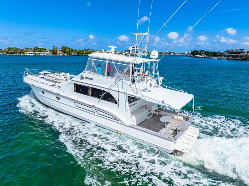 Slide: The Image of White 1996 Blackwell 72 yacht cruising on clear blue waters under a sunny sky. - 16