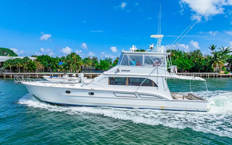 Slide: The Image of 1996 Blackwell 72 yacht cruising on a sunny day near a tropical shoreline. - 21