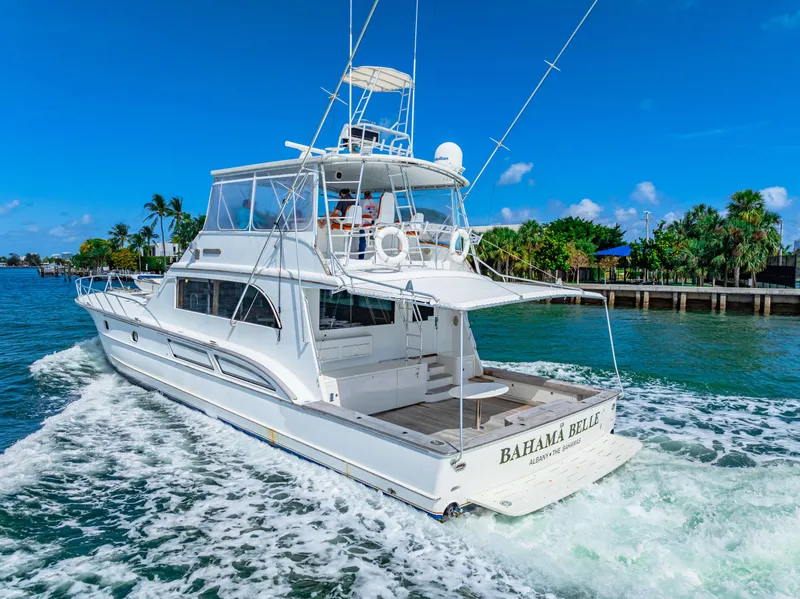 Slide: The Image of White 1996 Blackwell 72 yacht cruising in tropical waters near a lush coastline. - 23