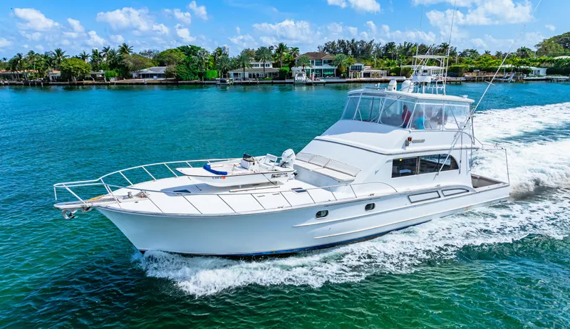 Slide: The Image of 1996 Blackwell 72 yacht cruising on a sunny day near a tropical shoreline. - 25