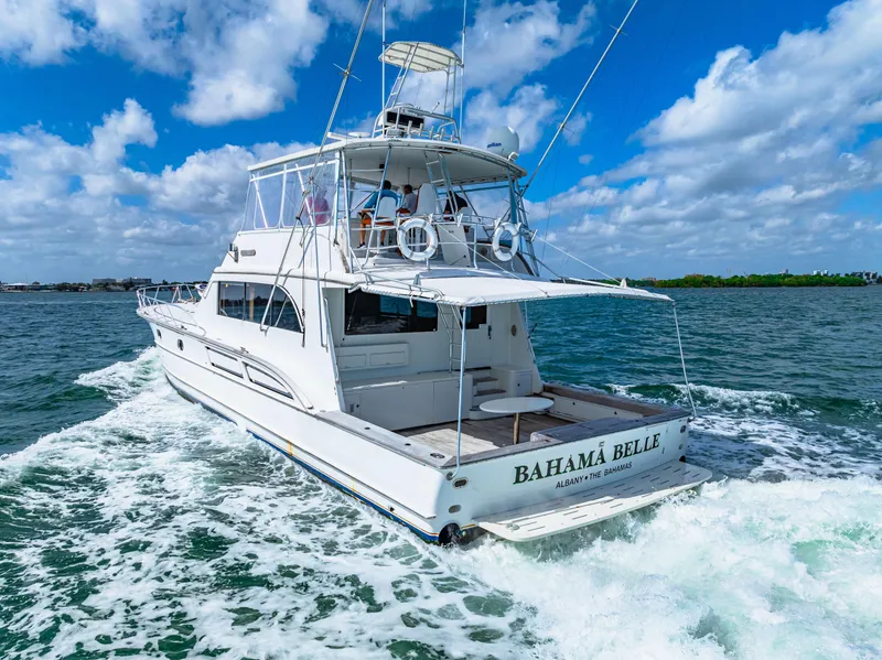 Slide: The Image of 1996 Blackwell 72 yacht Bahama Belle cruising on open water under a blue sky. - 26