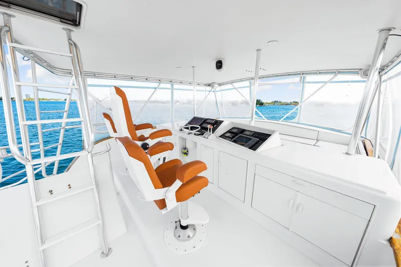 Slide: The Image of Interior helm of 1996 Blackwell 72 yacht with orange seats and navigation equipment. - 38