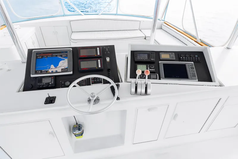 Slide: The Image of Blackwell 72 yacht helm station with navigation equipment, steering wheel, and throttle controls, 1996 model. - 40
