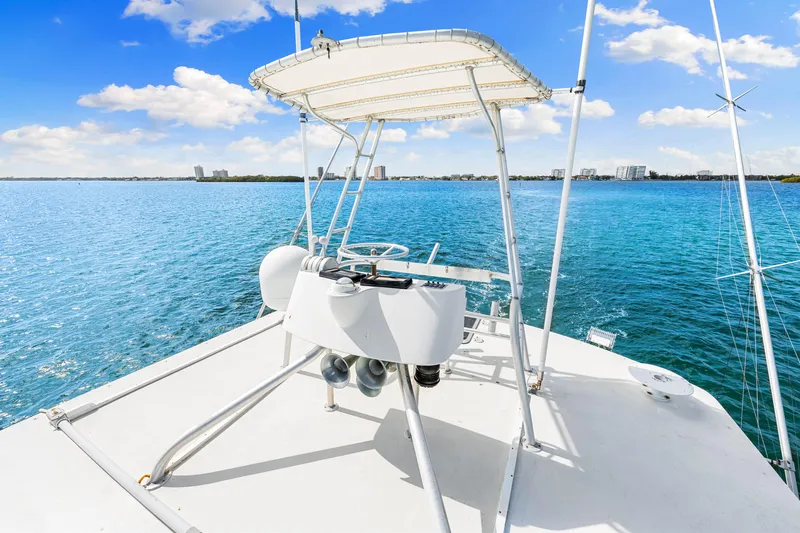 Slide: The Image of Blackwell 72 yacht, 1996 model, with a view of the ocean and city skyline. - 49