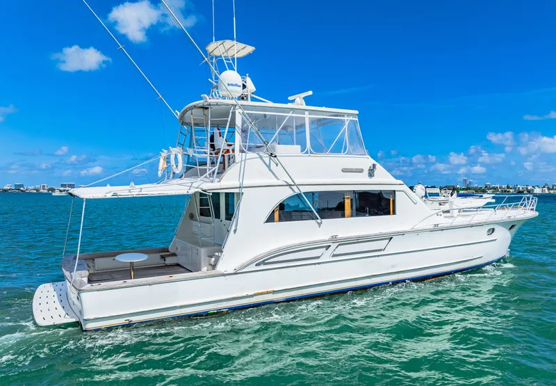 Slide: The Image of 1996 Blackwell 72 yacht cruising on clear blue water under a sunny sky. - 7